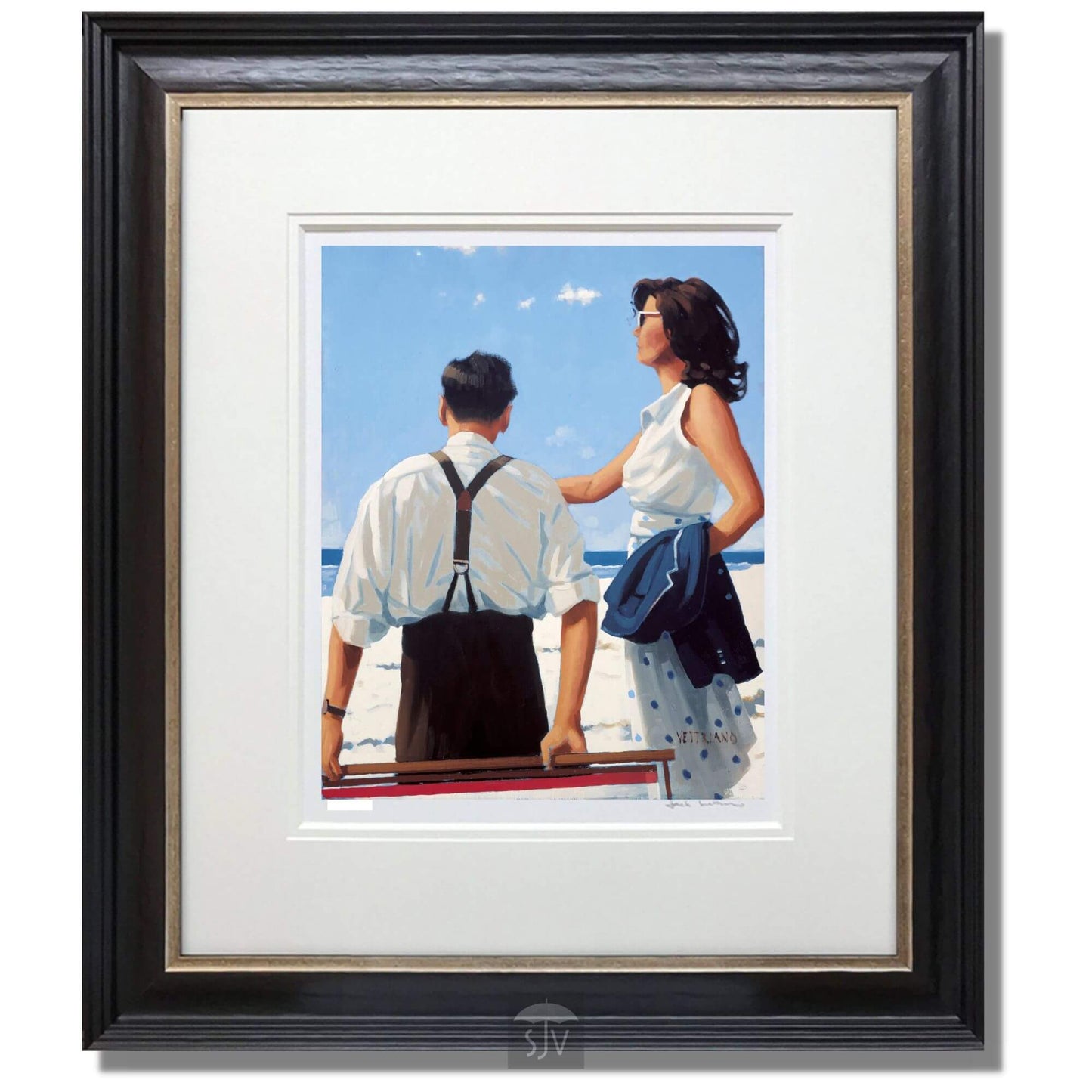 Framed artwork of a couple on a beach with the sky and ocean in the background