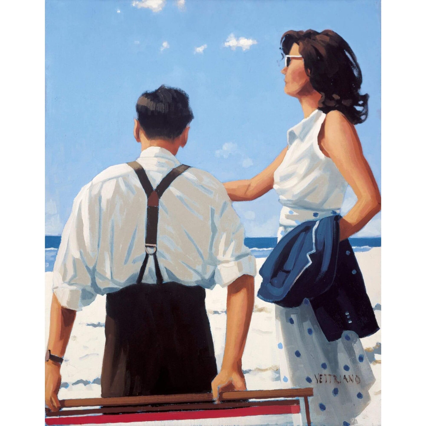Two people on a beach with a clear blue sky and ocean background