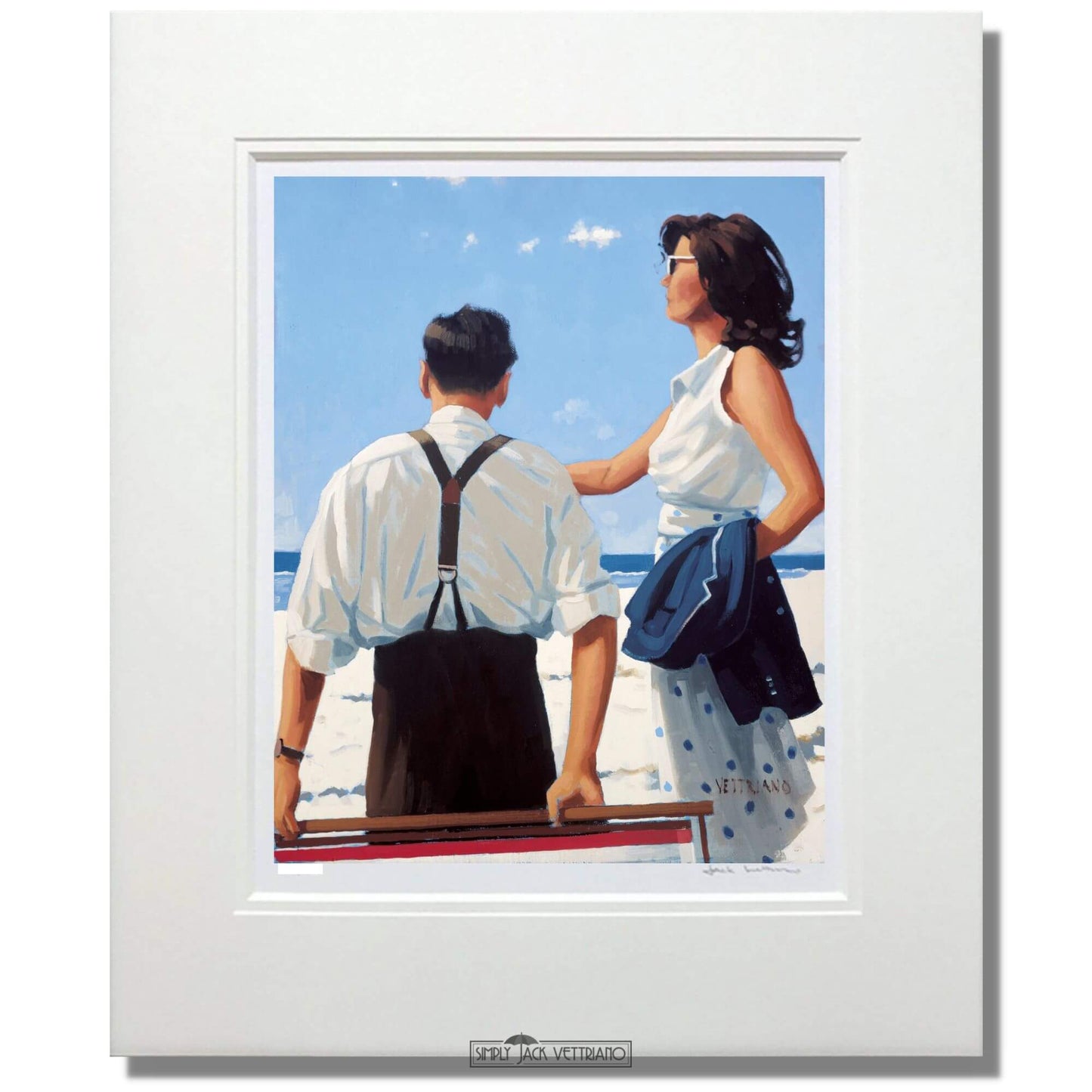 Mounted artwork of a couple on a beach with a white frame.